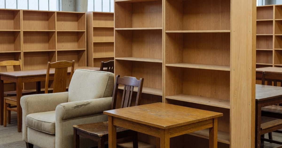 A showroom-style discounted furniture section with a few chairs, a side table and a bookshelf, illustrating IKEA sell-back and As-Is discounted furniture.