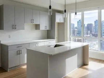 A condo kitchen with a new renovation, quartz countertops and upgraded cabinets.