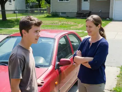 A teenage boy with his mother looking at a small used hatchback in the driveway.